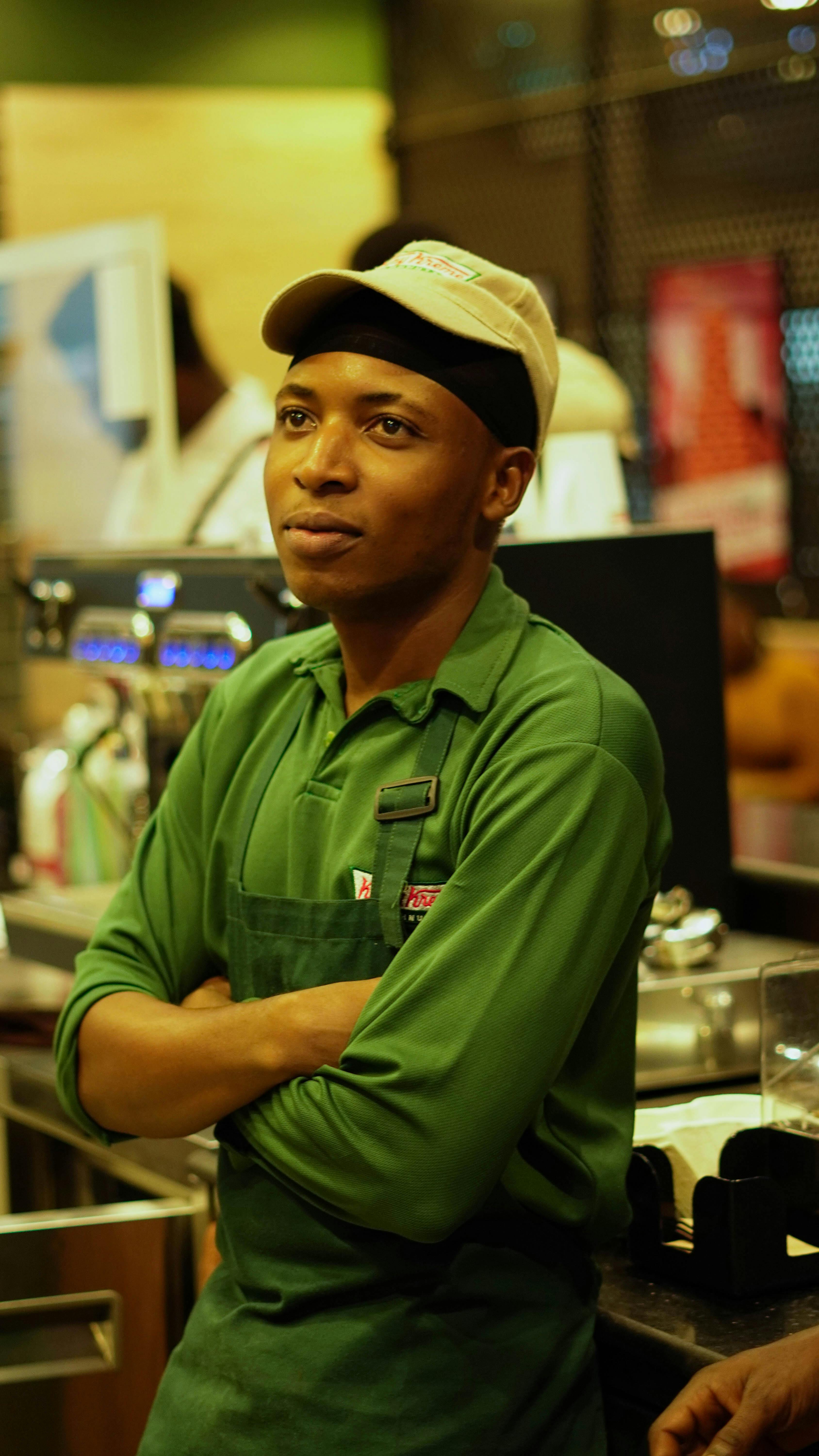 A HirePro hospitality professional in uniform behind the counter